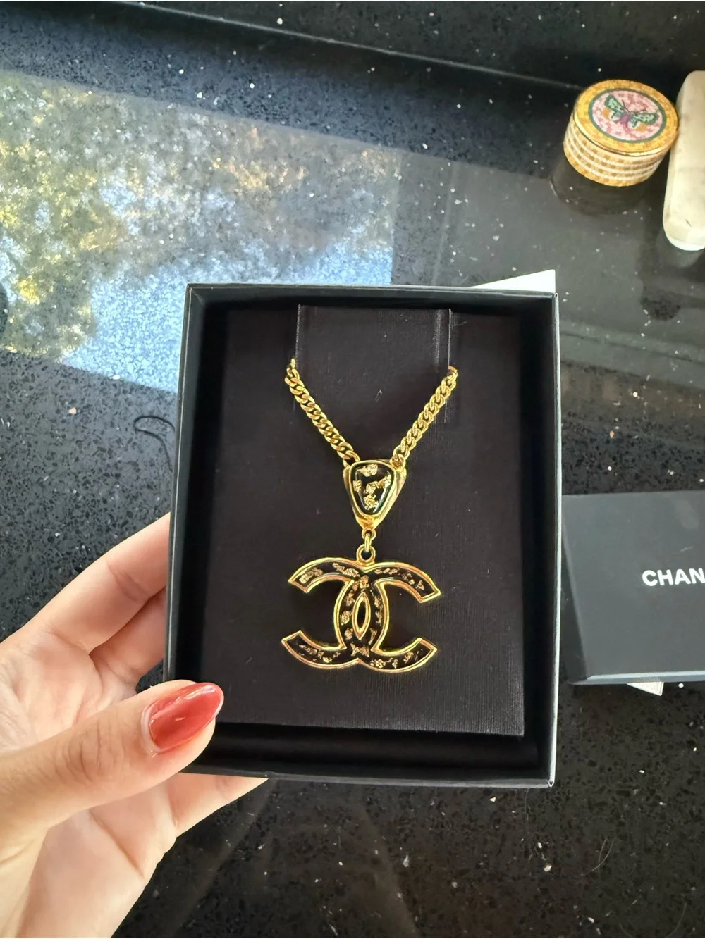 CHANEL gold tone